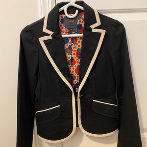 Black Blazer with white piping.